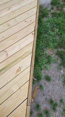 Normally you would snap a chalk line and make a straight cut on those boards, these look like someone was stumbling with a saw.