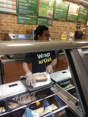 Noticed this gentleman working in a food prep area without a hat, believe thats a critical violation from NYS DOH.  Love the cookies btw.