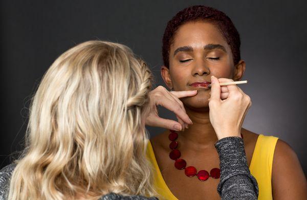 Makeup Artist Monica Bolyard touches lipstick for an SRK Headshot Day session.