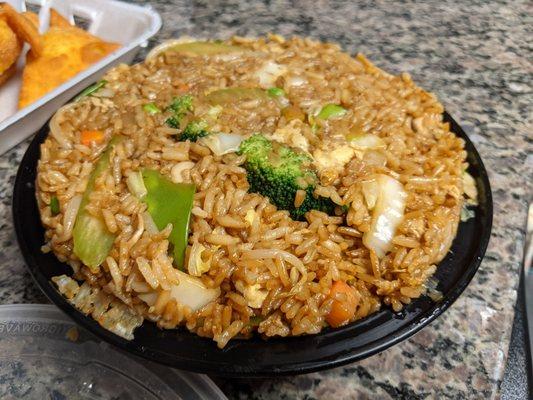 Fried rice with vegetables (adds broccoli, snap peas, and lots of mushrooms) ordered as takeout.