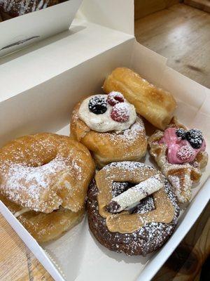 Strawberry shortcake, creme chantilly, peanut butter brownie, berry croffle, and glazed