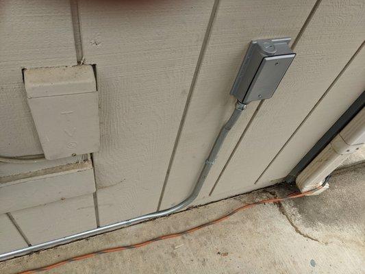 Electrical conduit linking electrical outlet to split system, installed by Usilton Electric.