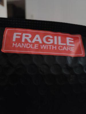 It's say Fragile handle with care .But seen the video.