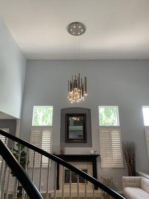 New chandelier mounted high up for customer