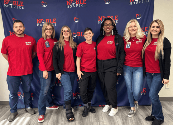 Noble hospice employees wearing their R.E.D. shirts.