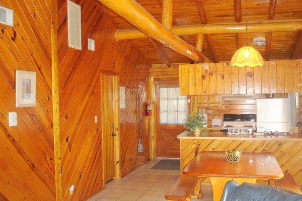 inside view of dining area towards kitchen of 2 bedroom/2 bath cabin