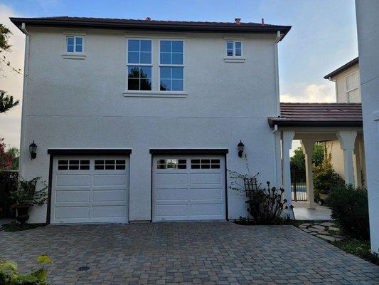 BEFORE - Two single car garage doors that were an impossible tight squeeze for a full size SUV.