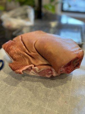 Skin-on, bone-in pork shoulder