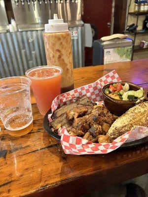 Brisket, pork belly, Mexican street corn, cucumber tomato salad and beeeer