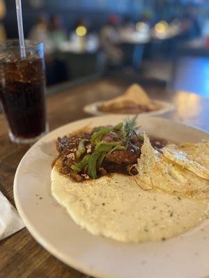 Smothered pork chops and grits