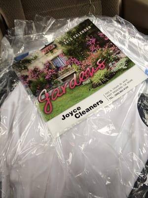 Joyce Cleaners calendar and dry cleaned clothes