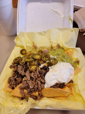 Half order of supreme nachos. The carne asada is so so so good!! Very tasty, chips were hot and fresh.