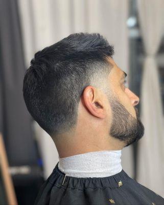 Low fade with textured scissor cut on top.