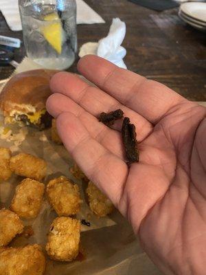 Burnt crap that made my tots taste burnt