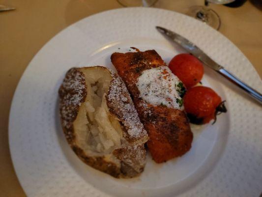 Salmon with salted skin baked potato.