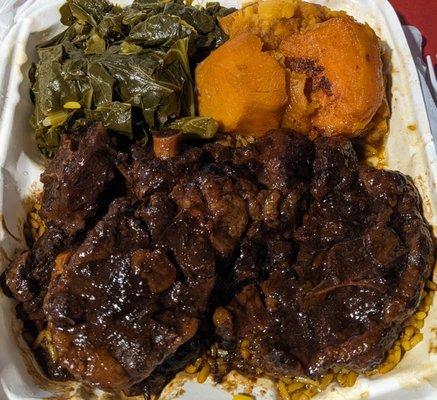 Oxtail dinner with collard greens and yams