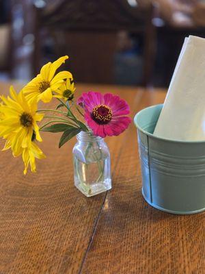 Cute flowers on each table.