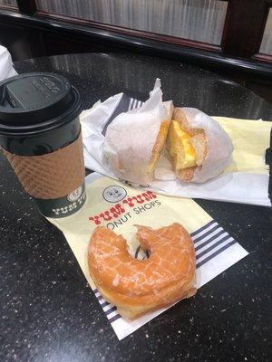 The Breakfast Combo - WOW! Regular coffee, glazed donut and a egg and cheese breakfast sandwich on a sesame bagel.