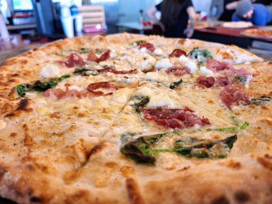 Popeye pizza close-up at RX Pizza. Yum!