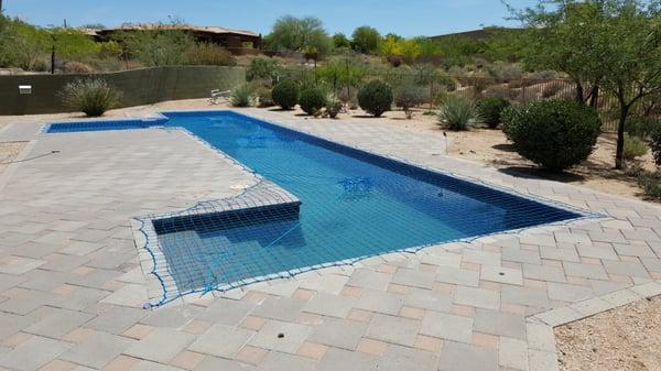 Pool safety nets are so versatile - they can accommodate custom shaped inground pools.