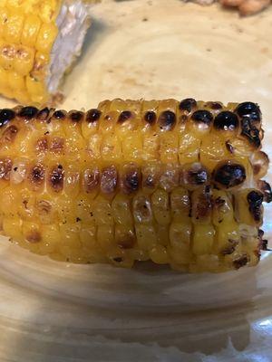 The corn is burnt and has bad texture and is a little bit hard to bite.