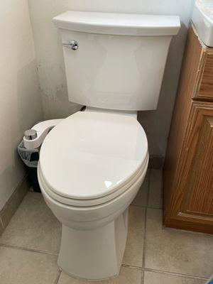 New toilet install with new bidet attachment.