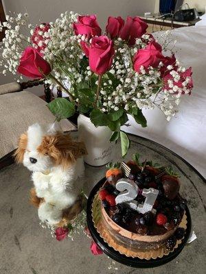 I got all this from Albertsons . Cake $15 dog $13 flowers $17 and vase $2 . Not bad