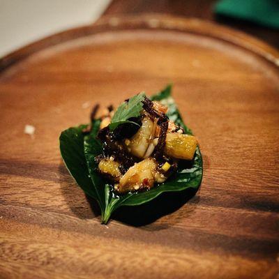 Miang som appetizer, which is shrimp bits with orange and peanut served as a wrap with betel leaf.