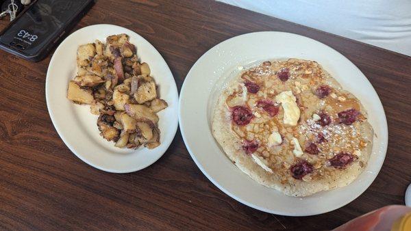 Raspberry - white chocolate chip pancake and a side of home fries