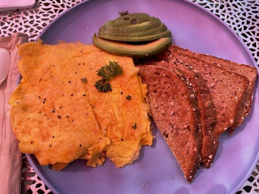 The TOURIST breakfast. Unripe avocado. It was so hard I couldn't eat it. Eggs were just a hard brick of scrambled eggs. YUCK