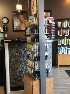 Travel sizes, reception desk, nail polish display.