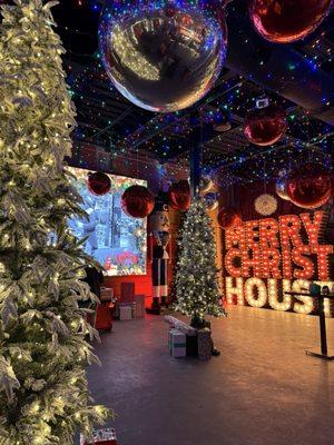 Dance floor decked out for Christmas in front of DJ booth.