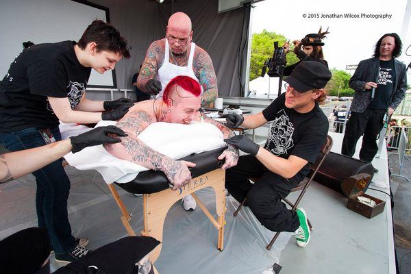 body piercing world record. 1400 needles pierced through this man's body is 52 minutes. I'll personally put 777 into my friends legs etc...