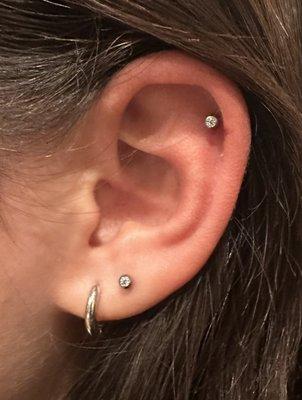 Second lobe piercing and upper helix by Midori