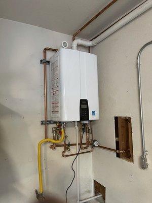 A happy residential customer with their new tankless