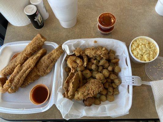 31. 3ea fish, shrimp, and oysters either fried or grilled with 2ea sides Mac n Cheese and Fried Okra