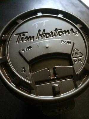 The "TT" on the cup stands for "triple, triple" which means "three creams, three sugars" in Tim Horton speak!