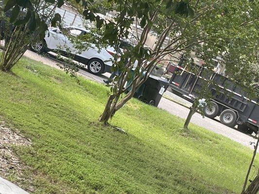 man checking trash can