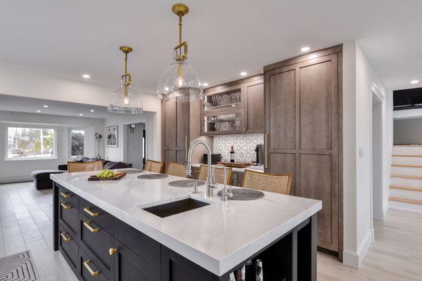 Custom Rutt kitchen, brass hardware, open to dining and living areas. Long kitchen island. South Shore Long Island , NY