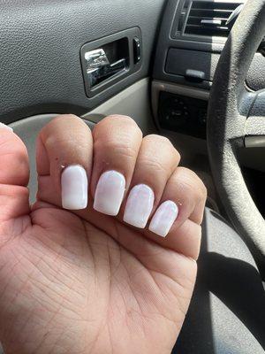 Polish is not even. Some nails are more white than others