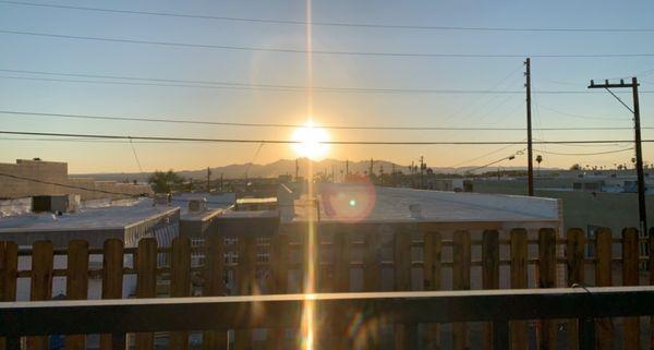 View of sunset from pool area