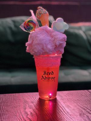 Candyland- Choice of Juice topped with cotton candy, rainbow lollipop and marshmallows