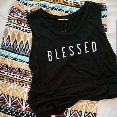 Sleeveless Blessed shirt and tribal print skirt