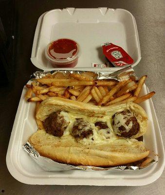 Meatball hoagie with fries. Comes with salt, ketchup, and cup of sauce.