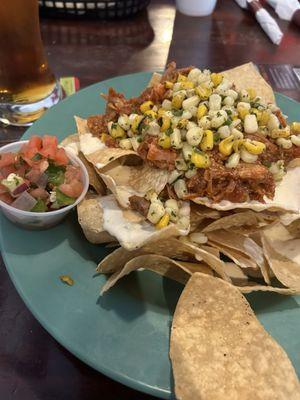 Pulled pork nachos with street corn and pico