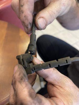 Break pad sensor- this part is tucked inside the car so unless someone was changing the brake pads- it isn't possible to break like this.