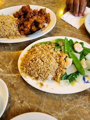 Orange chicken and peapods and shrimp   with fried rice