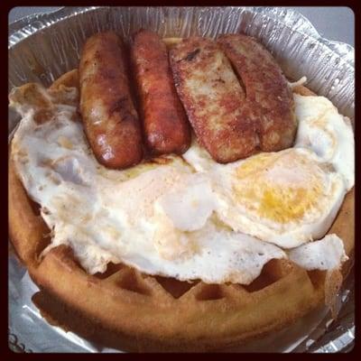 Best breakfast ever !! Sausage with waffles and fried eggs .