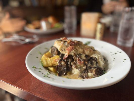 Chicken Marsala over Risotto with seasonal vegetables.