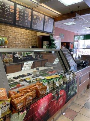 Empty Subway restaurant with an empty counter as well.